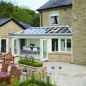 Cream uPVC double hipped Edwardian conservatory/orangery style with bi-fold doors