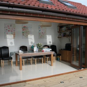Rosewood uPVC bi-fold doors with golden oak frame
