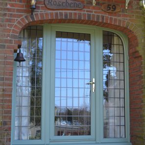 Chartwell green window with arched head with square leaded glass