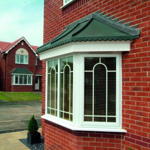 White uPVC double glazed bay window with special Georgian inserts