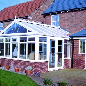 White uPVC Regency conservatory and replacement windows and doors