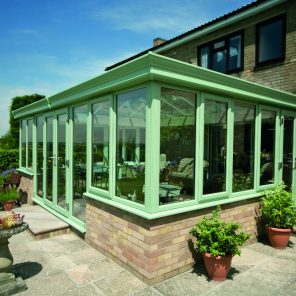 Green uPVC double glazed conservatory with windows and doors