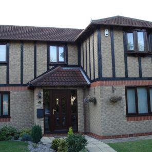 Coordinating Rosewood woodgrain windows and doors in uPVC