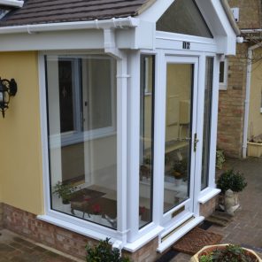 Glass porch entrance with tiled roof