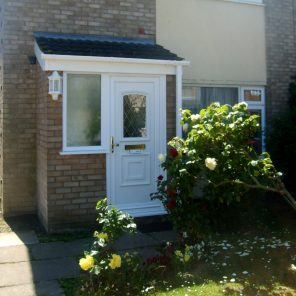 Brick porch with double glazed door and tiled roof